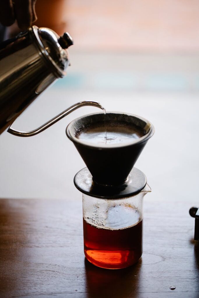 Close-up of a manual pour-over coffee brewing setup with rich aesthetics.